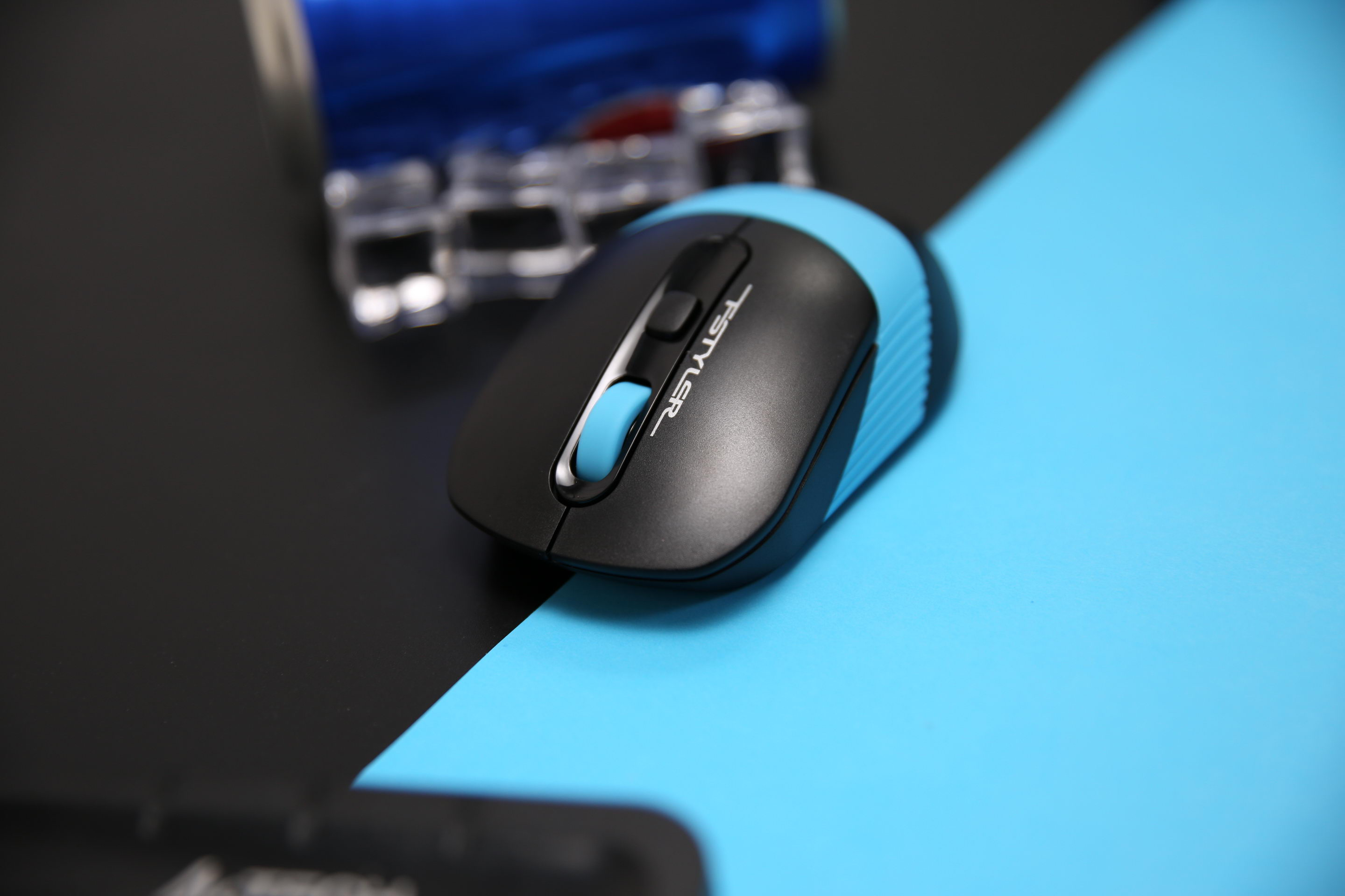 FG10S black and blue mouse on a blue desktop